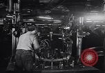 Image of Affixing car frame to chassis Dearborn Michigan USA, 1937, second 29 stock footage video 65675031007