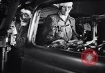 Image of Affixing car frame to chassis Dearborn Michigan USA, 1937, second 33 stock footage video 65675031007
