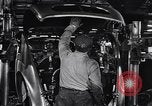 Image of Affixing car frame to chassis Dearborn Michigan USA, 1937, second 38 stock footage video 65675031007