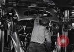 Image of Affixing car frame to chassis Dearborn Michigan USA, 1937, second 39 stock footage video 65675031007