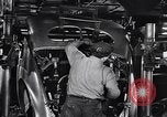Image of Affixing car frame to chassis Dearborn Michigan USA, 1937, second 40 stock footage video 65675031007