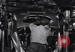 Image of Affixing car frame to chassis Dearborn Michigan USA, 1937, second 41 stock footage video 65675031007
