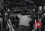 Image of Affixing car frame to chassis Dearborn Michigan USA, 1937, second 42 stock footage video 65675031007