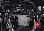 Image of Affixing car frame to chassis Dearborn Michigan USA, 1937, second 43 stock footage video 65675031007