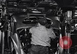 Image of Affixing car frame to chassis Dearborn Michigan USA, 1937, second 44 stock footage video 65675031007