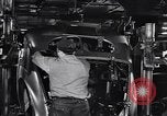 Image of Affixing car frame to chassis Dearborn Michigan USA, 1937, second 45 stock footage video 65675031007