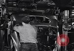 Image of Affixing car frame to chassis Dearborn Michigan USA, 1937, second 46 stock footage video 65675031007