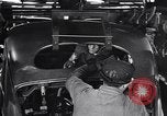 Image of Affixing car frame to chassis Dearborn Michigan USA, 1937, second 48 stock footage video 65675031007