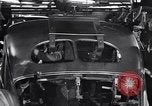 Image of Affixing car frame to chassis Dearborn Michigan USA, 1937, second 52 stock footage video 65675031007