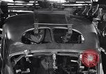 Image of Affixing car frame to chassis Dearborn Michigan USA, 1937, second 53 stock footage video 65675031007