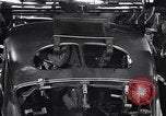 Image of Affixing car frame to chassis Dearborn Michigan USA, 1937, second 54 stock footage video 65675031007