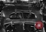 Image of Affixing car frame to chassis Dearborn Michigan USA, 1937, second 56 stock footage video 65675031007