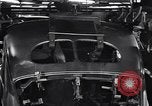 Image of Affixing car frame to chassis Dearborn Michigan USA, 1937, second 57 stock footage video 65675031007