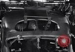 Image of Affixing car frame to chassis Dearborn Michigan USA, 1937, second 58 stock footage video 65675031007