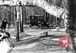 Image of Ford Model-T near icy pond United States USA, 1917, second 3 stock footage video 65675031043