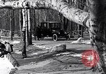 Image of Ford Model-T near icy pond United States USA, 1917, second 8 stock footage video 65675031043