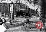 Image of Ford Model-T near icy pond United States USA, 1917, second 10 stock footage video 65675031043