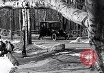 Image of Ford Model-T near icy pond United States USA, 1917, second 11 stock footage video 65675031043