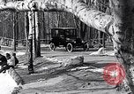 Image of Ford Model-T near icy pond United States USA, 1917, second 15 stock footage video 65675031043