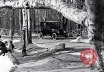 Image of Ford Model-T near icy pond United States USA, 1917, second 16 stock footage video 65675031043