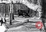 Image of Ford Model-T near icy pond United States USA, 1917, second 17 stock footage video 65675031043