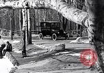 Image of Ford Model-T near icy pond United States USA, 1917, second 18 stock footage video 65675031043