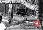 Image of Ford Model-T near icy pond United States USA, 1917, second 19 stock footage video 65675031043