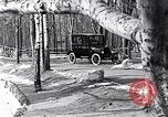 Image of Ford Model-T near icy pond United States USA, 1917, second 21 stock footage video 65675031043