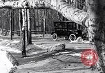Image of Ford Model-T near icy pond United States USA, 1917, second 22 stock footage video 65675031043