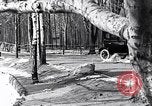 Image of Ford Model-T near icy pond United States USA, 1917, second 23 stock footage video 65675031043