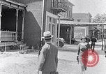 Image of Well dressed African-Americans waiting at a school near a Tennessee Emergency relief camp Tennessee USA, 1936, second 13 stock footage video 65675031562
