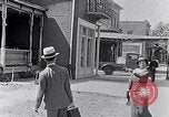 Image of Well dressed African-Americans waiting at a school near a Tennessee Emergency relief camp Tennessee USA, 1936, second 14 stock footage video 65675031562