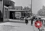 Image of Well dressed African-Americans waiting at a school near a Tennessee Emergency relief camp Tennessee USA, 1936, second 17 stock footage video 65675031562