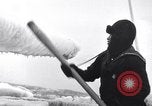 Image of Sailors chop ice from Japanese light cruiser Aleutians, 1942, second 3 stock footage video 65675031675