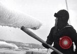 Image of Sailors chop ice from Japanese light cruiser Aleutians, 1942, second 4 stock footage video 65675031675