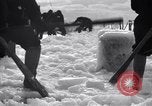 Image of Sailors chop ice from Japanese light cruiser Aleutians, 1942, second 9 stock footage video 65675031675