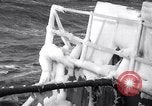 Image of Sailors chop ice from Japanese light cruiser Aleutians, 1942, second 19 stock footage video 65675031675