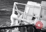 Image of Sailors chop ice from Japanese light cruiser Aleutians, 1942, second 20 stock footage video 65675031675