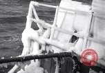 Image of Sailors chop ice from Japanese light cruiser Aleutians, 1942, second 21 stock footage video 65675031675