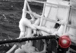 Image of Sailors chop ice from Japanese light cruiser Aleutians, 1942, second 22 stock footage video 65675031675
