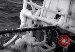 Image of Sailors chop ice from Japanese light cruiser Aleutians, 1942, second 23 stock footage video 65675031675
