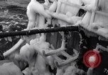 Image of Sailors chop ice from Japanese light cruiser Aleutians, 1942, second 24 stock footage video 65675031675