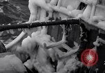 Image of Sailors chop ice from Japanese light cruiser Aleutians, 1942, second 25 stock footage video 65675031675