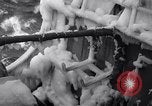 Image of Sailors chop ice from Japanese light cruiser Aleutians, 1942, second 26 stock footage video 65675031675