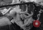 Image of Sailors chop ice from Japanese light cruiser Aleutians, 1942, second 28 stock footage video 65675031675