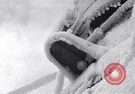 Image of Sailors chop ice from Japanese light cruiser Aleutians, 1942, second 31 stock footage video 65675031675