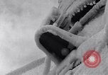Image of Sailors chop ice from Japanese light cruiser Aleutians, 1942, second 32 stock footage video 65675031675