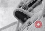 Image of Sailors chop ice from Japanese light cruiser Aleutians, 1942, second 34 stock footage video 65675031675