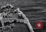 Image of Sailors chop ice from Japanese light cruiser Aleutians, 1942, second 35 stock footage video 65675031675