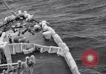Image of Sailors chop ice from Japanese light cruiser Aleutians, 1942, second 36 stock footage video 65675031675